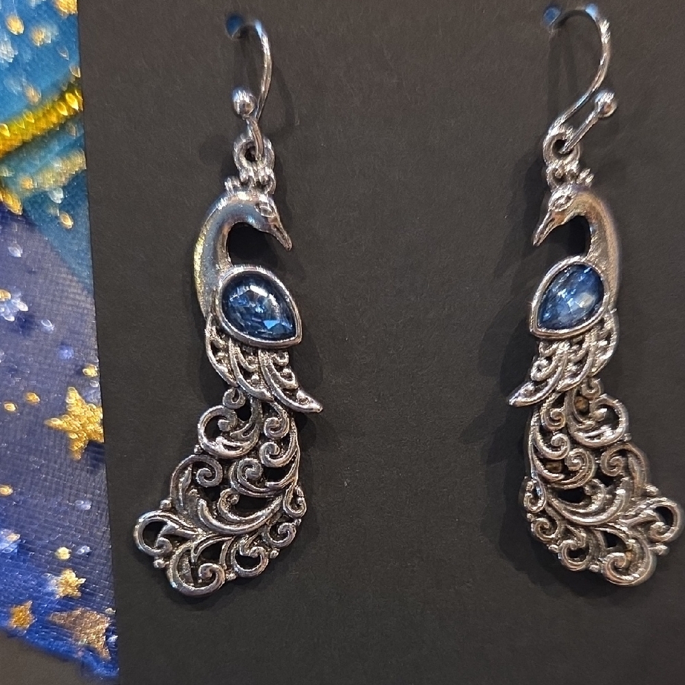 Intricate Silver Earrings with Blue Gem Accents